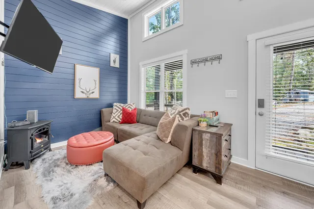 a living room with furniture and a flat screen tv