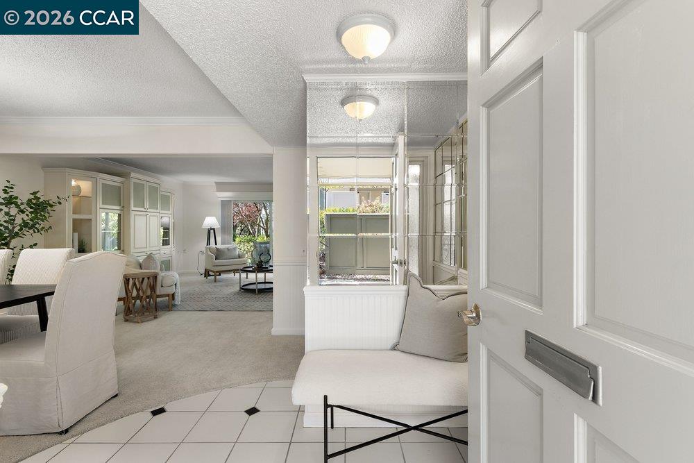 a living room with furniture and large windows