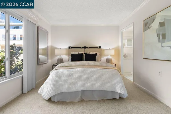 a bedroom with a bed and window