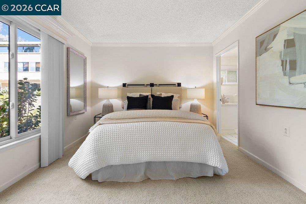 2057 Golden Rain Road, Unit 8 Walnut Creek, CA 94595 - Photo 1 of 60 a bedroom with a bed and window