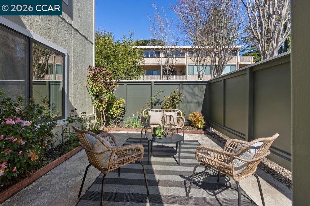 2057 Golden Rain Road, Unit 8 Walnut Creek, CA 94595 - Photo 12 of 60 a view of a chairs and table in the patio