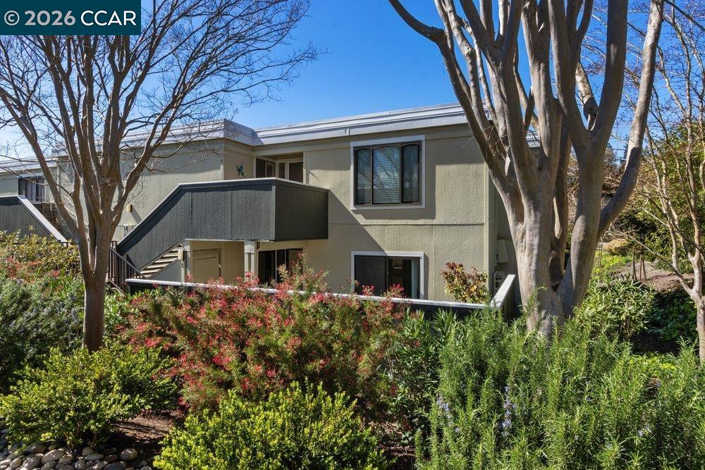2057 Golden Rain Road, Unit 8 Walnut Creek, CA 94595 - Photo 14 of 60 a front view of a house with garden