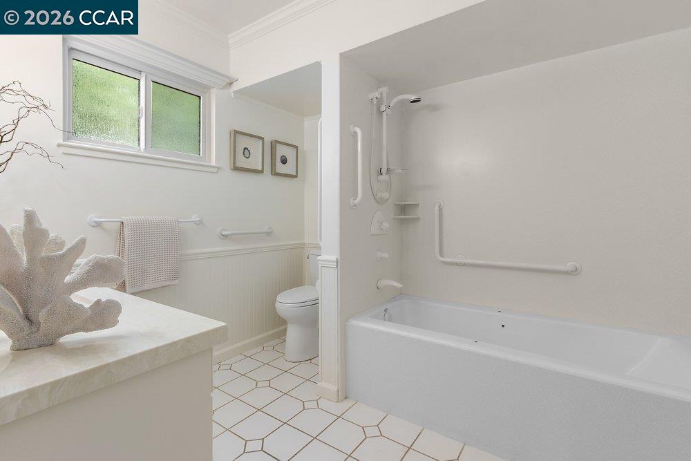 2057 Golden Rain Road, Unit 8 Walnut Creek, CA 94595 - Photo 2 of 60 a bathroom with a sink a toilet and shower