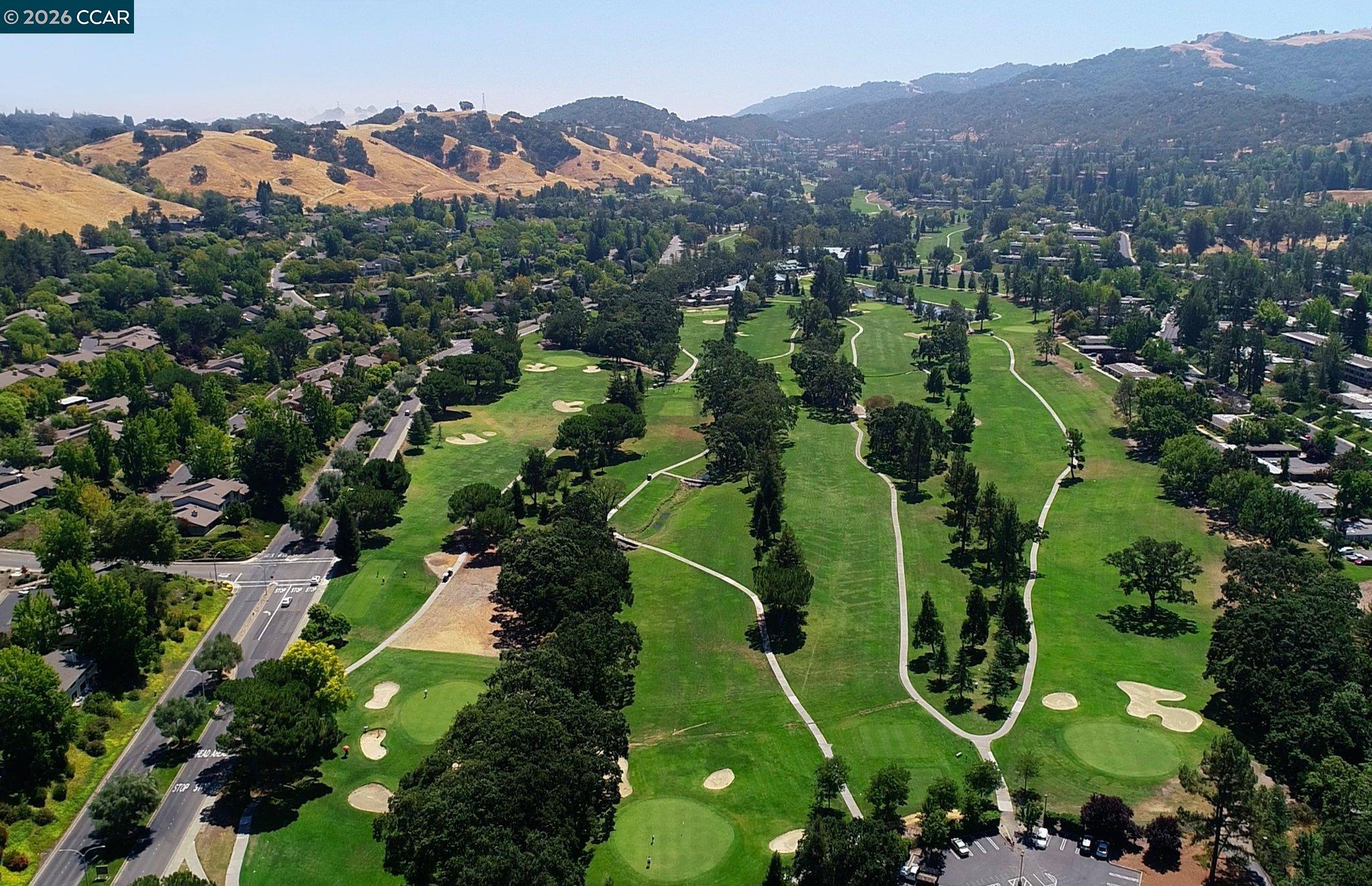2057 Golden Rain Road, Unit 8 Walnut Creek, CA 94595 - Photo 25 of 60 an aerial view of a golf course with parking space