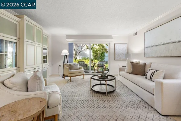 a kitchen with sink a stove and microwave
