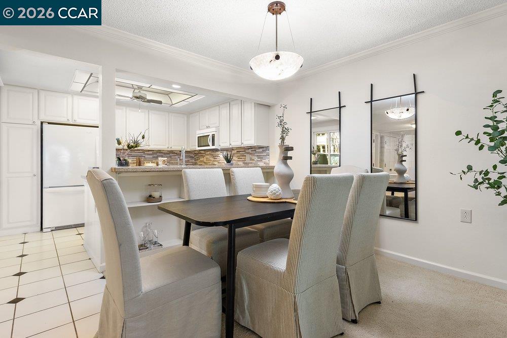 2057 Golden Rain Road, Unit 8 Walnut Creek, CA 94595 - Photo 48 of 60 a view of a dining room with furniture