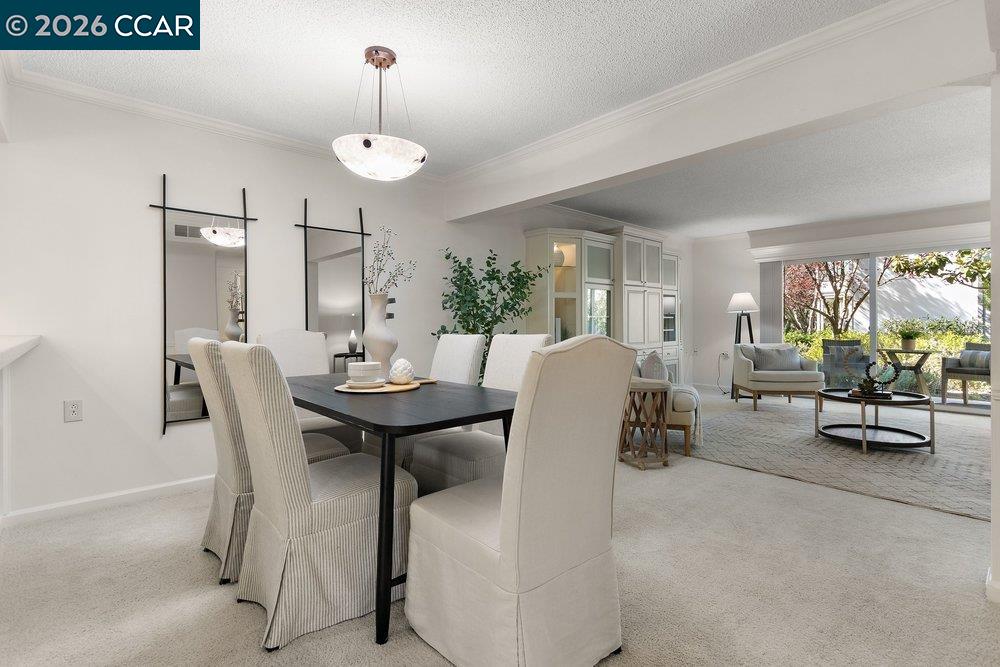 2057 Golden Rain Road, Unit 8 Walnut Creek, CA 94595 - Photo 49 of 60 a view of a dining room with furniture window and outside view