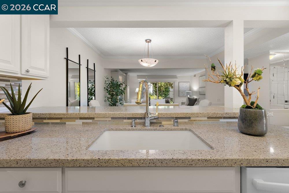 2057 Golden Rain Road, Unit 8 Walnut Creek, CA 94595 - Photo 53 of 60 a kitchen with a sink and a mirror