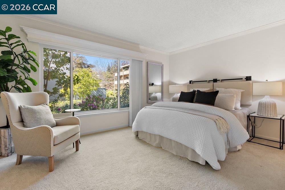 2057 Golden Rain Road, Unit 8 Walnut Creek, CA 94595 - Photo 55 of 60 a bedroom with a bed and a couch