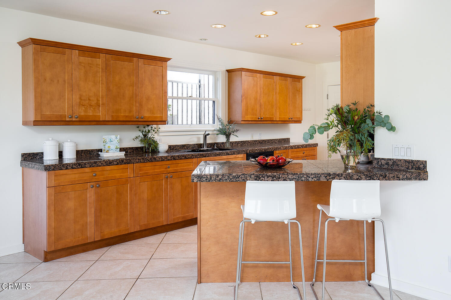 1273 Crescent Drive Glendale, CA 91205 - Photo 12 of 34 a kitchen with stainless steel appliances granite countertop a sink and a refrigerator