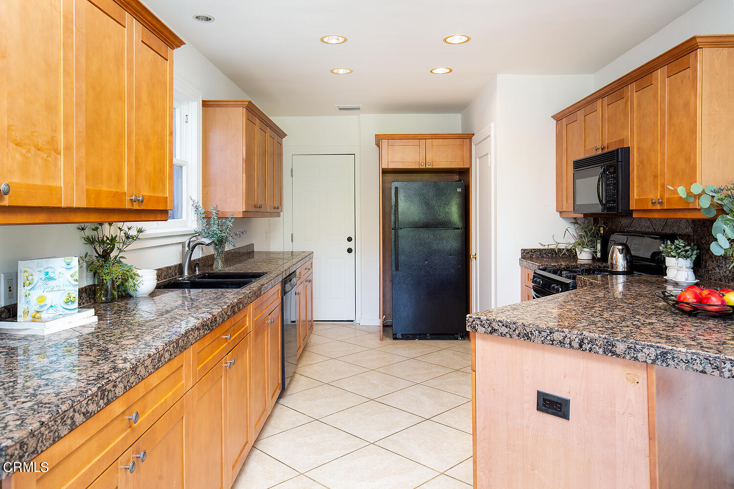 1273 Crescent Drive Glendale, CA 91205 - Photo 13 of 34 a kitchen with stainless steel appliances granite countertop a sink a stove and a refrigerator