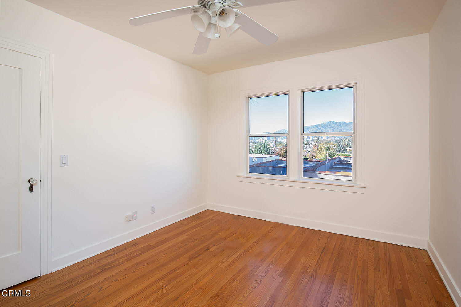 1273 Crescent Drive Glendale, CA 91205 - Photo 16 of 34 an empty room with a window and wooden floor
