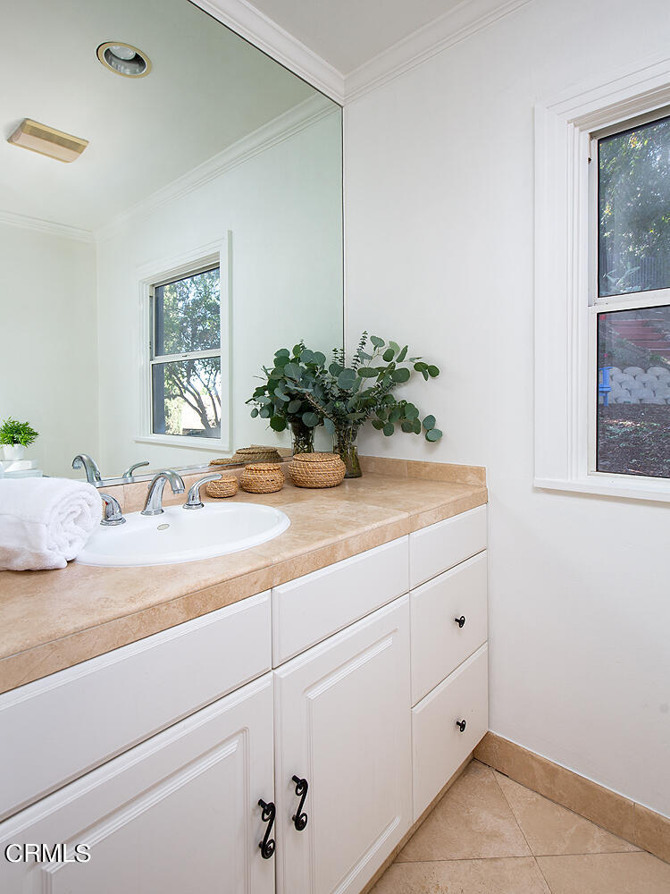 1273 Crescent Drive Glendale, CA 91205 - Photo 21 of 34 a bathroom with a sink and a mirror