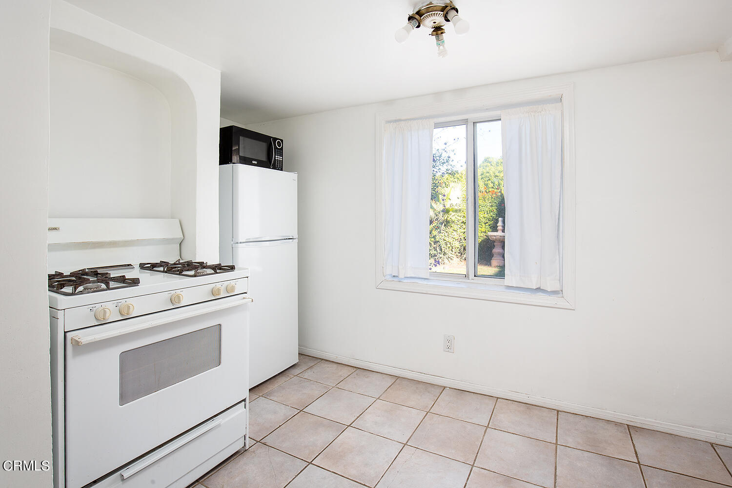 1273 Crescent Drive Glendale, CA 91205 - Photo 32 of 34 a kitchen with a stove and a refrigerator