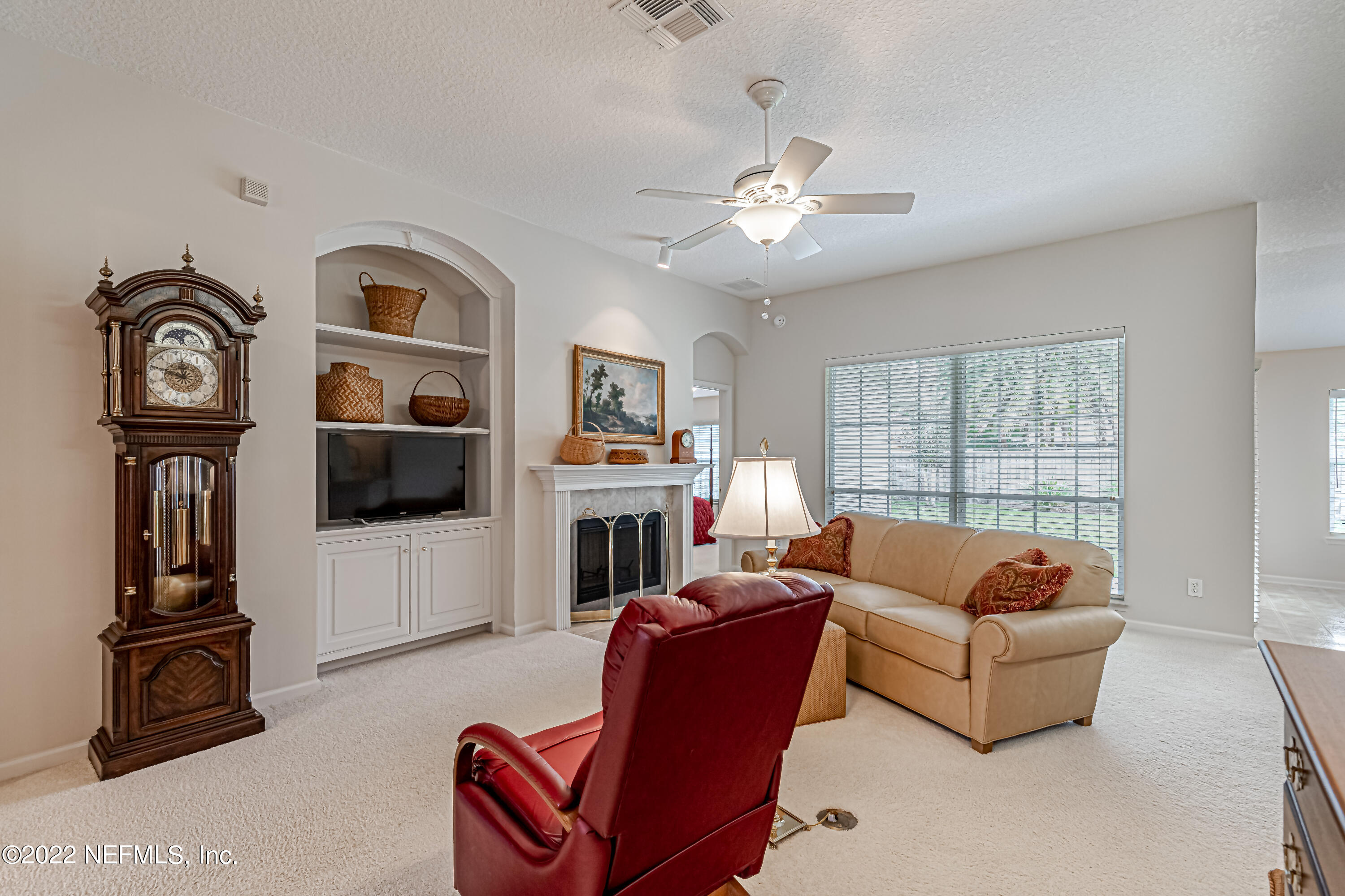 124 Dragonfly Drive Jacksonville, FL 32259 - Photo 13 of 40 a living room with furniture and a flat screen tv