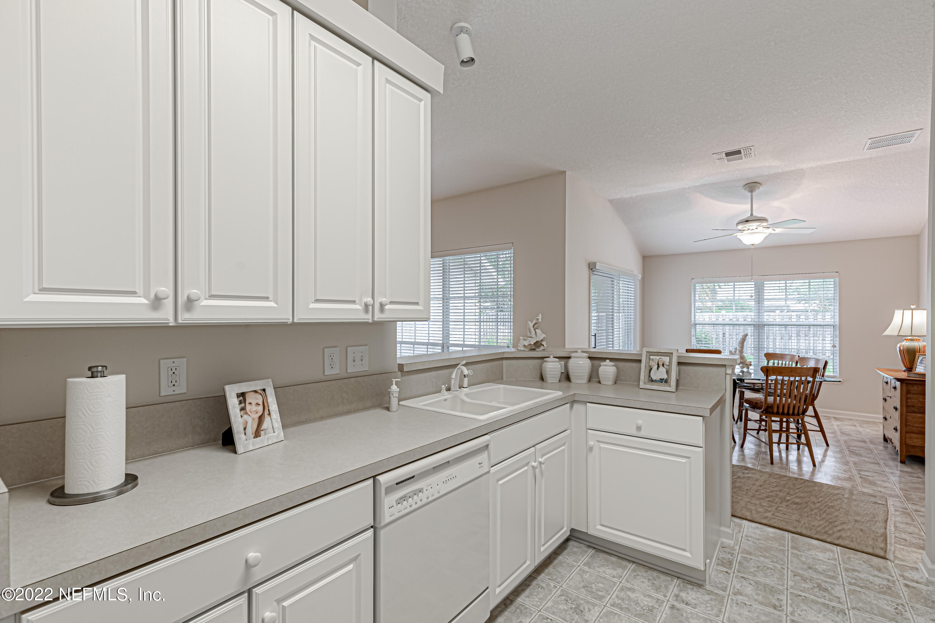 124 Dragonfly Drive Jacksonville, FL 32259 - Photo 18 of 40 a kitchen with appliances cabinets and a sink