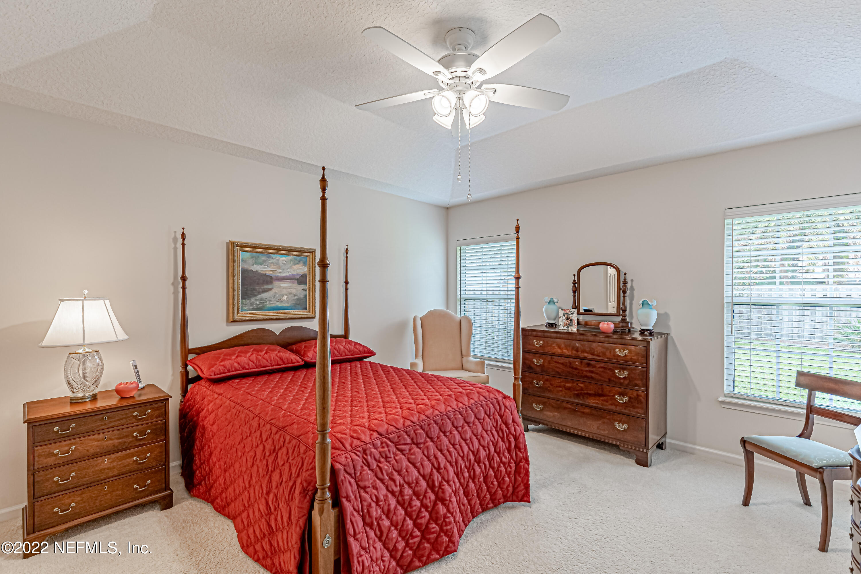 124 Dragonfly Drive Jacksonville, FL 32259 - Photo 22 of 40 a bedroom with bed and a chandelier