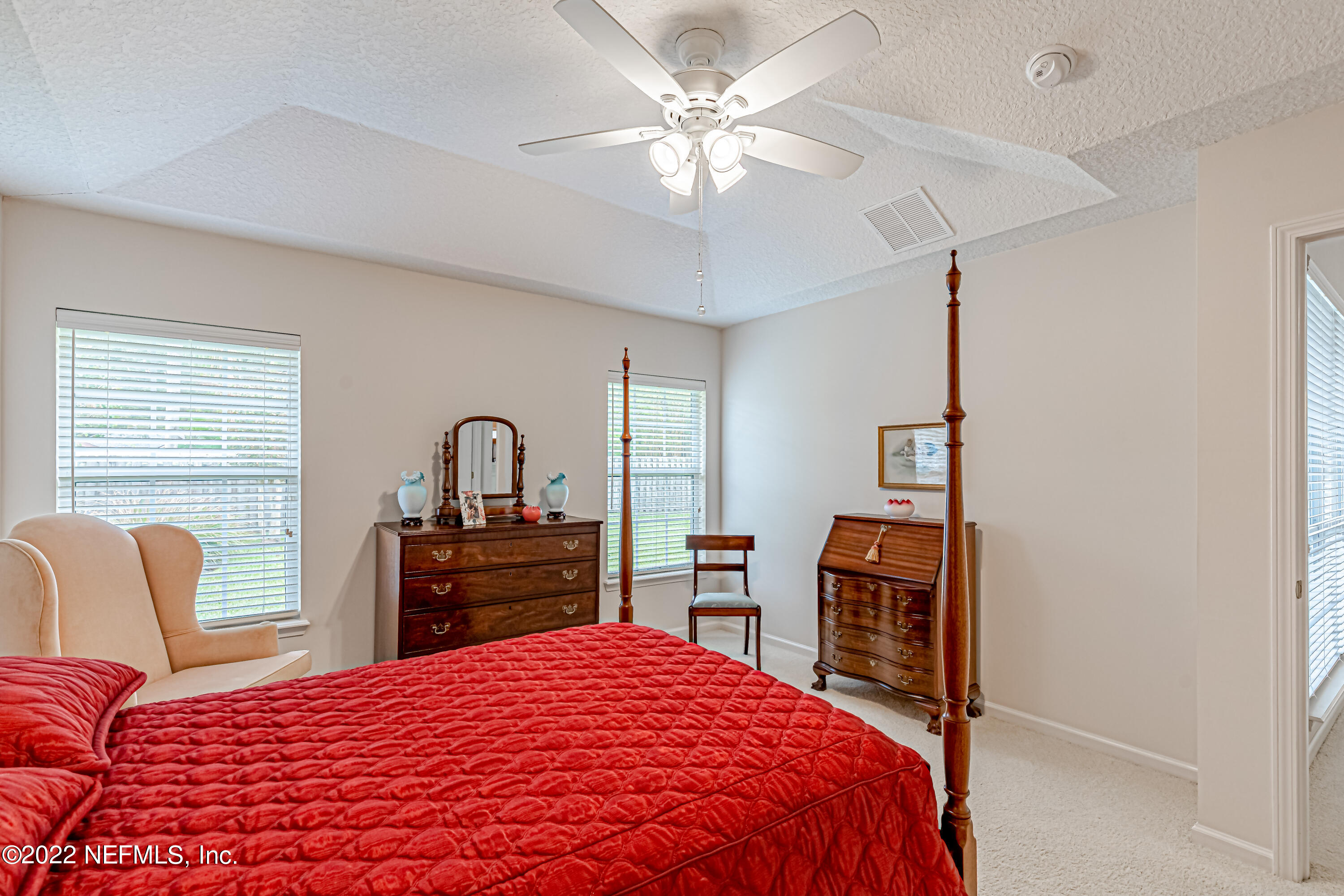 124 Dragonfly Drive Jacksonville, FL 32259 - Photo 24 of 40 a bedroom with a bed and dresser with mirror