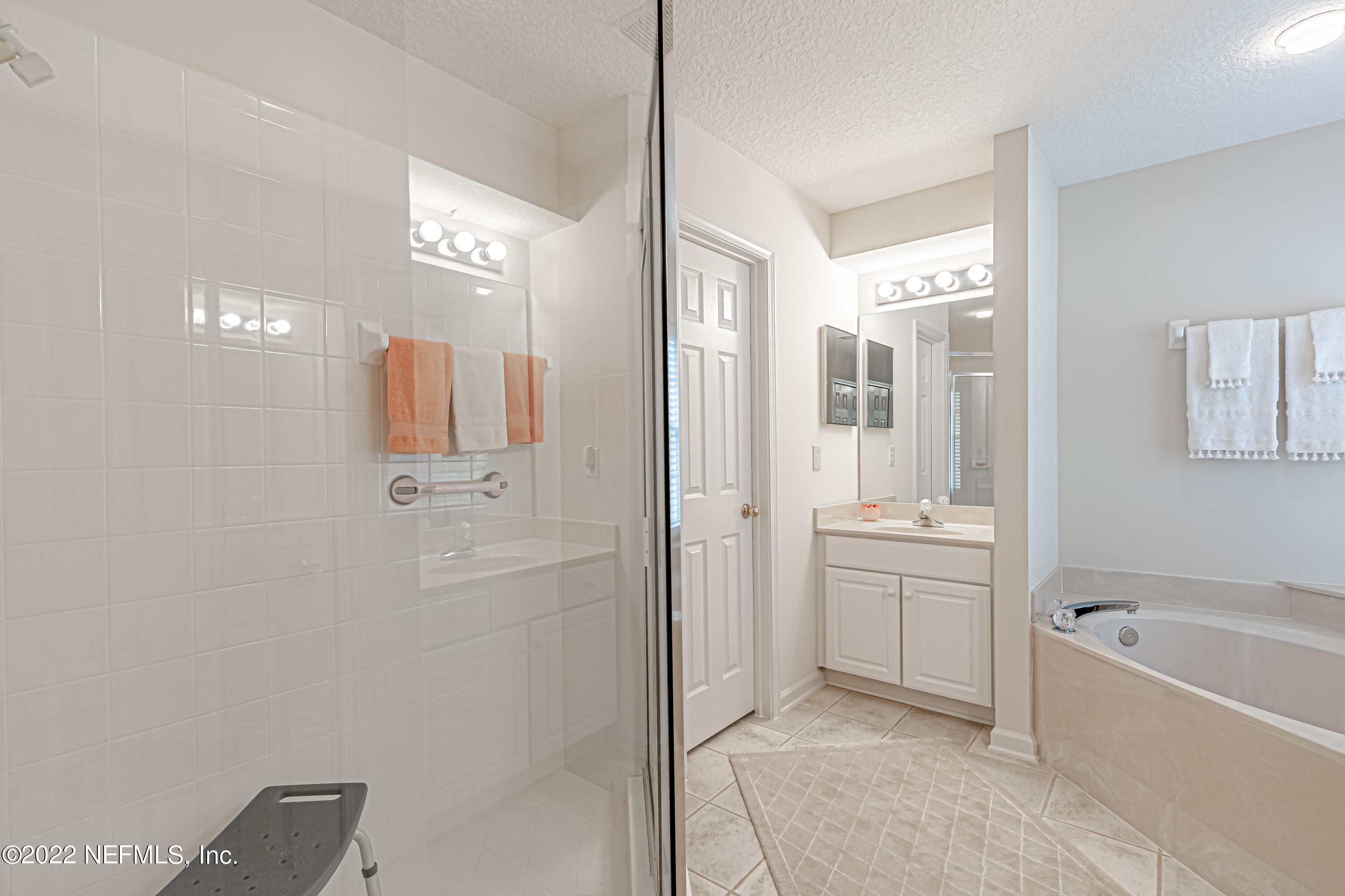 124 Dragonfly Drive Jacksonville, FL 32259 - Photo 25 of 40 a bathroom with a tub sink shower and mirror