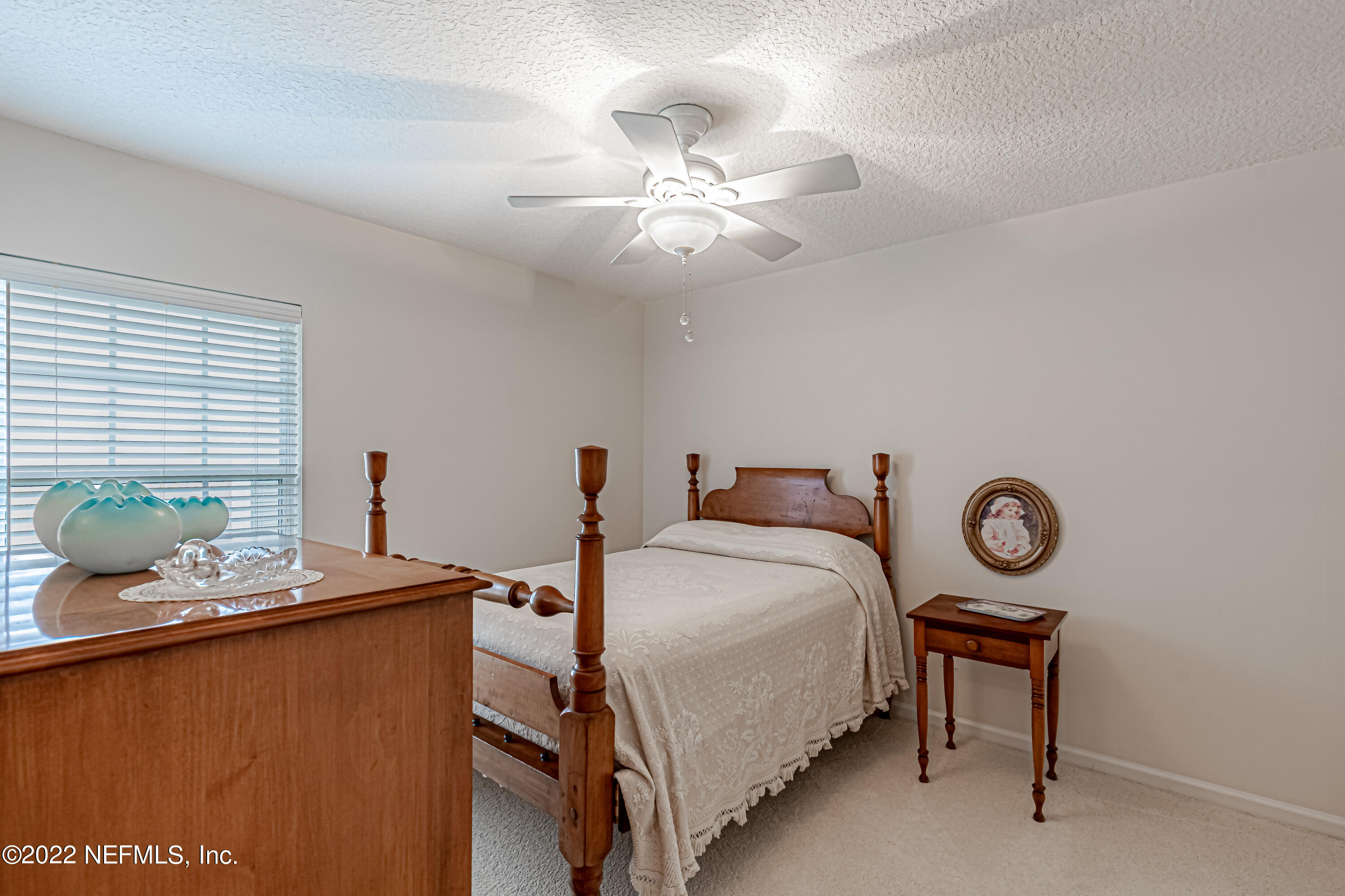 124 Dragonfly Drive Jacksonville, FL 32259 - Photo 33 of 40 a bedroom with a bed and a table