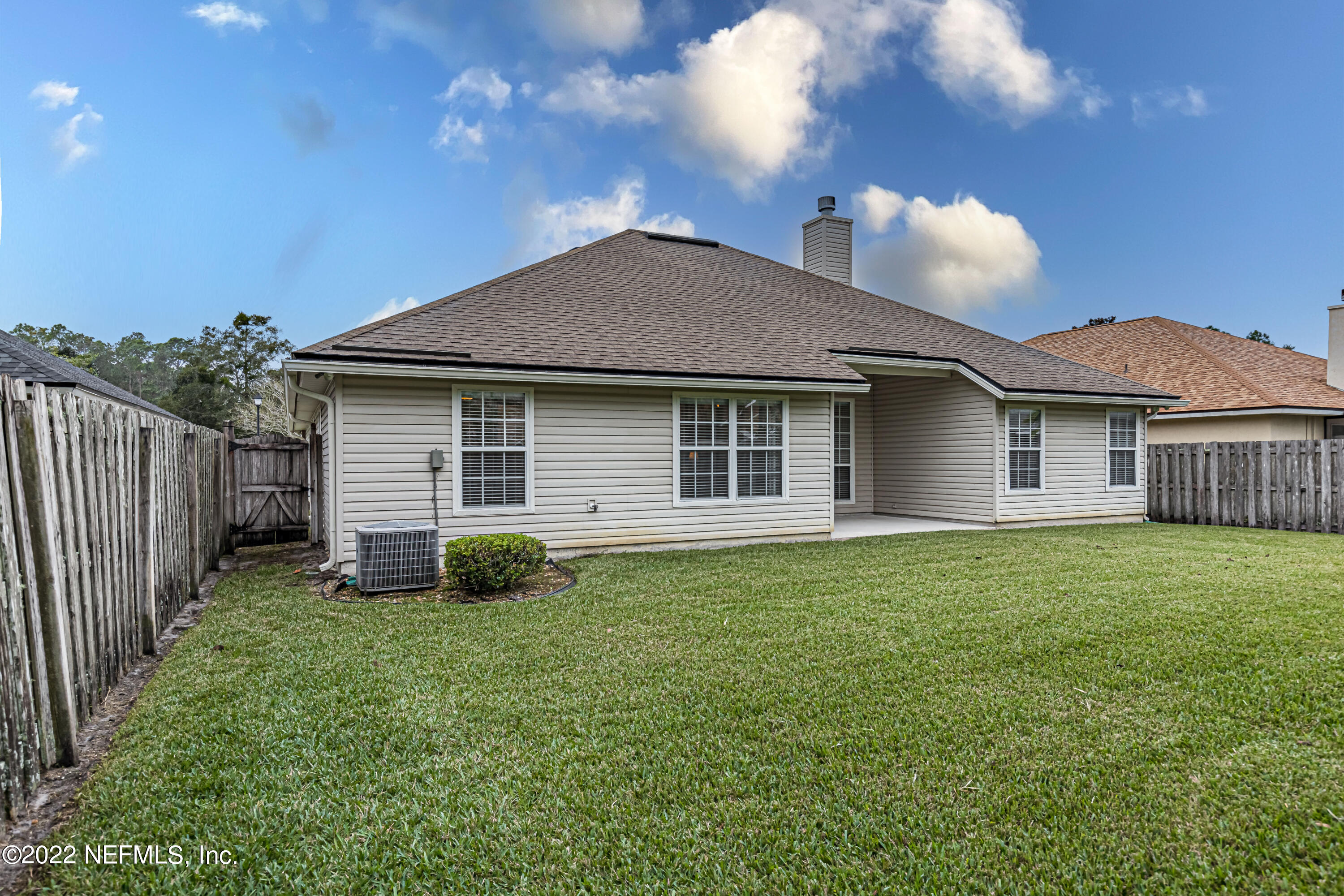 124 Dragonfly Drive Jacksonville, FL 32259 - Photo 38 of 40 a backyard of a house with lots of green space
