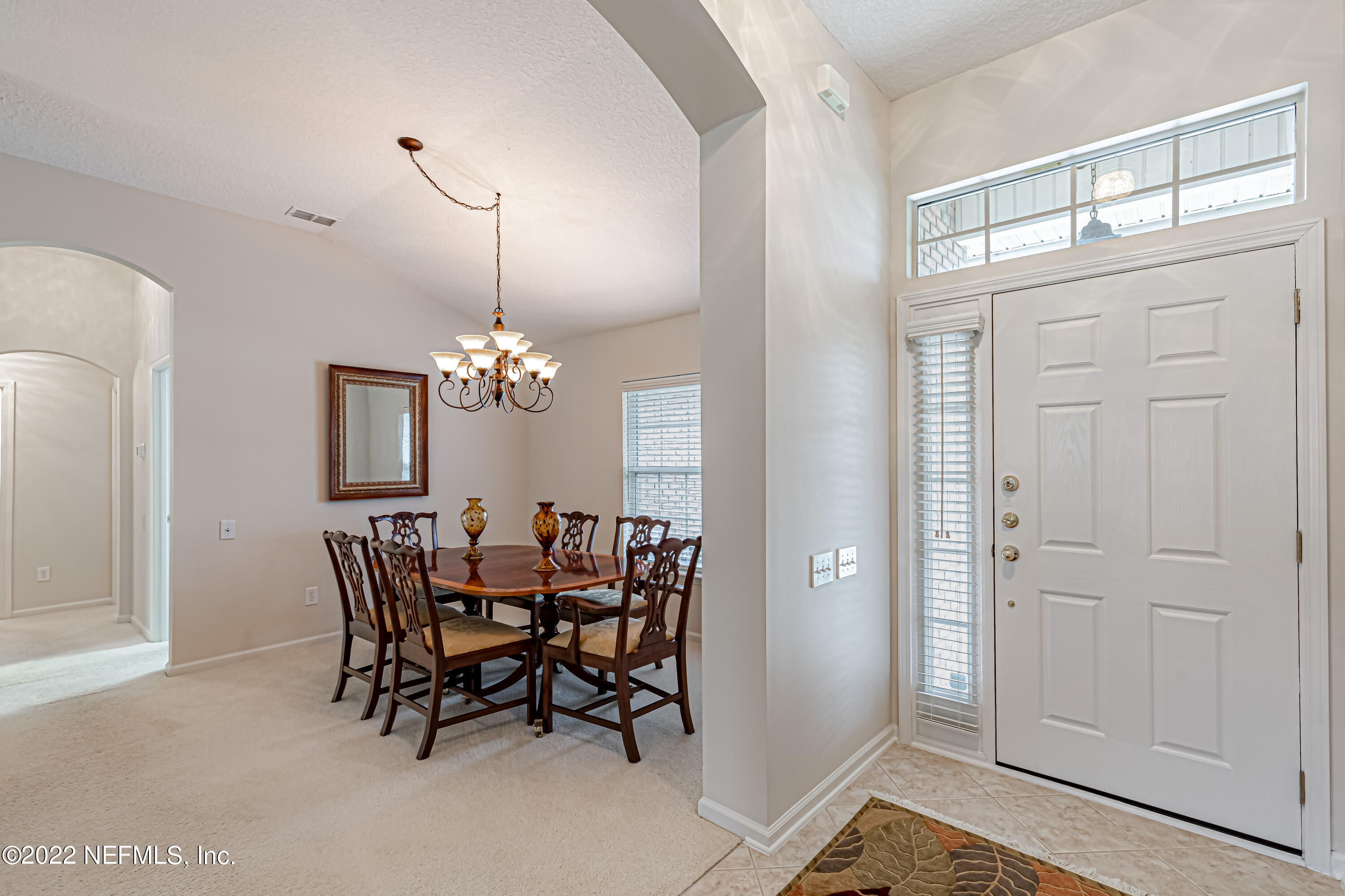 124 Dragonfly Drive Jacksonville, FL 32259 - Photo 6 of 40 a view of a dining room with furniture and chandelier