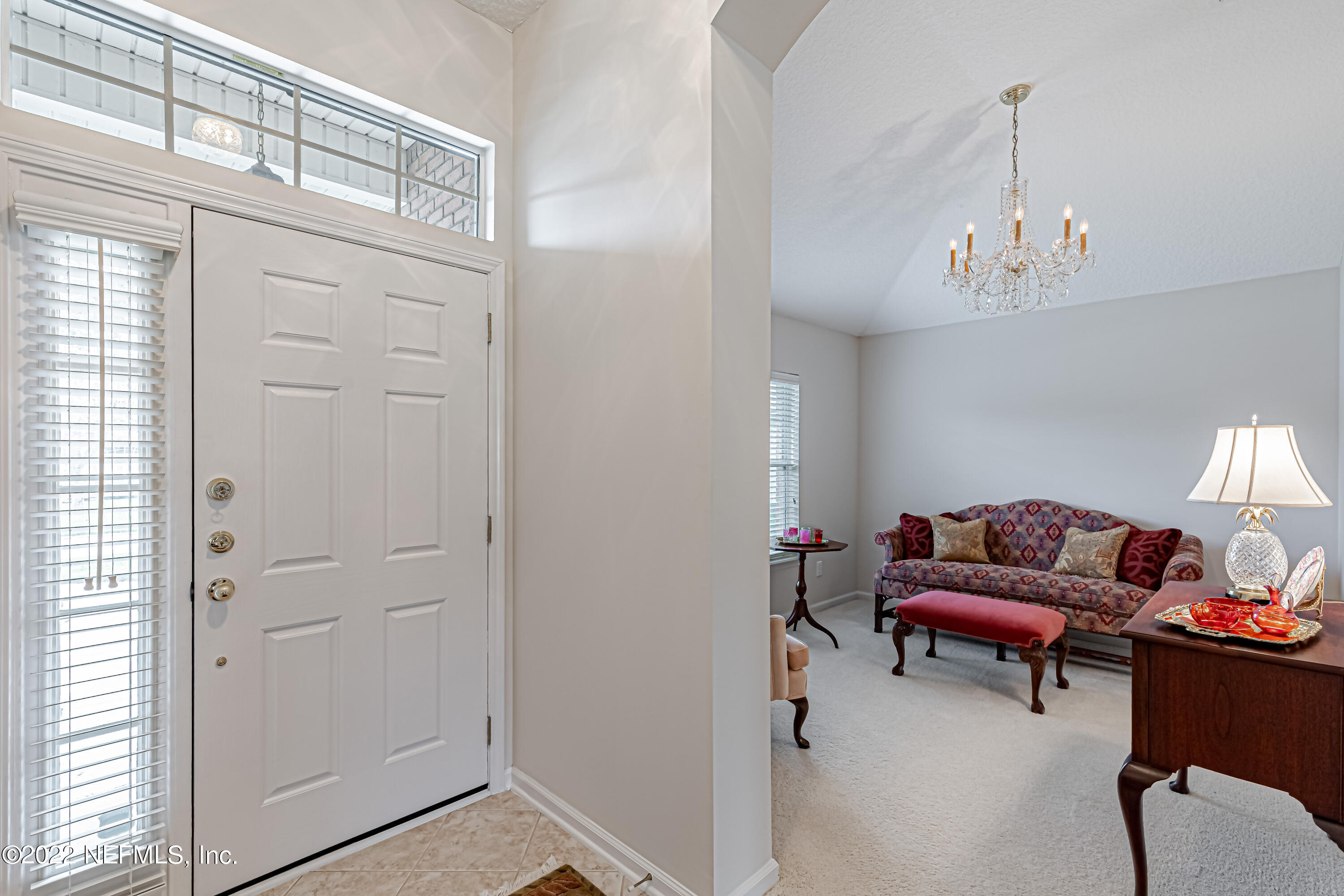 124 Dragonfly Drive Jacksonville, FL 32259 - Photo 7 of 40 a living room with furniture and a chandelier