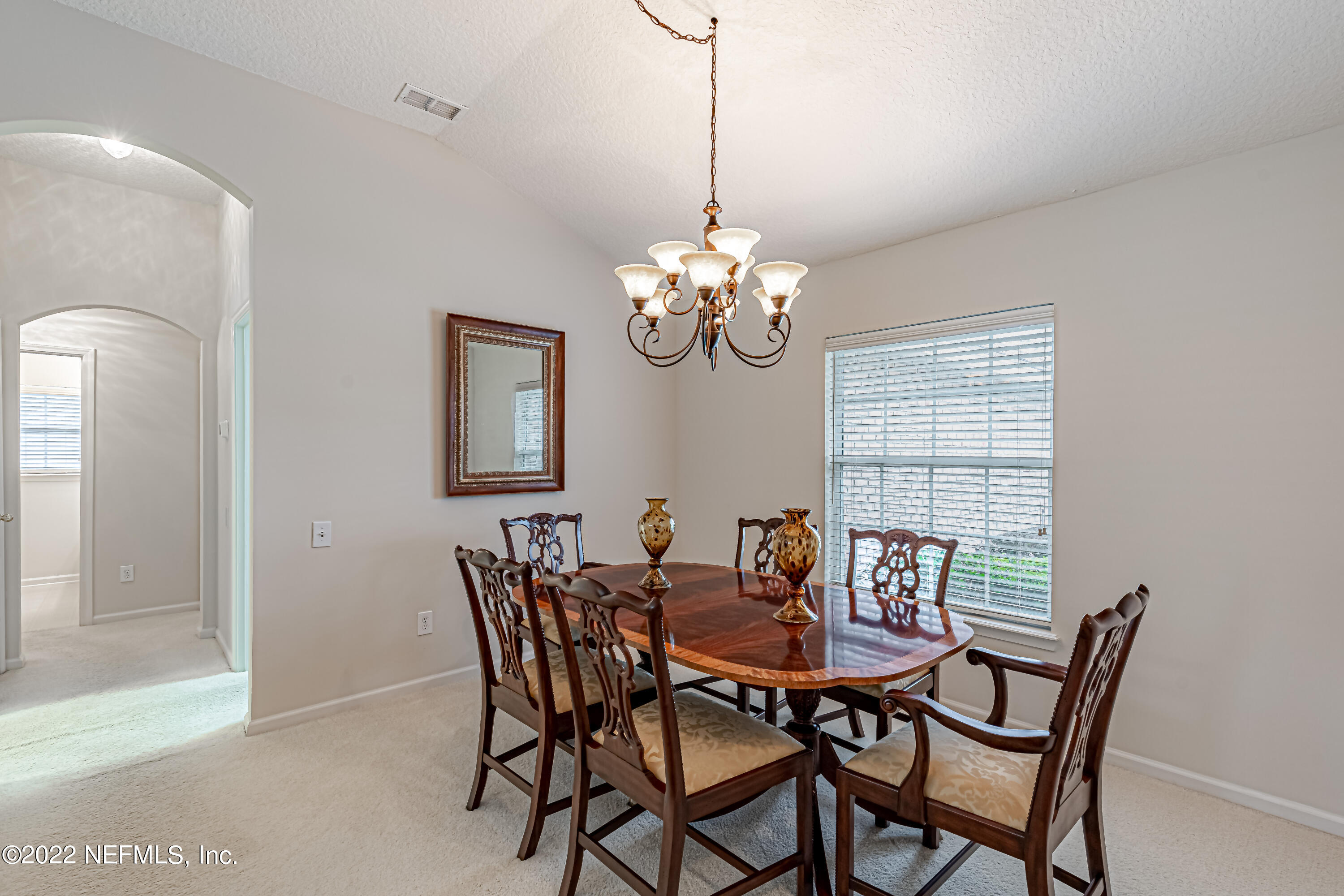 124 Dragonfly Drive Jacksonville, FL 32259 - Photo 9 of 40 a view of a dining room with furniture and chandelier