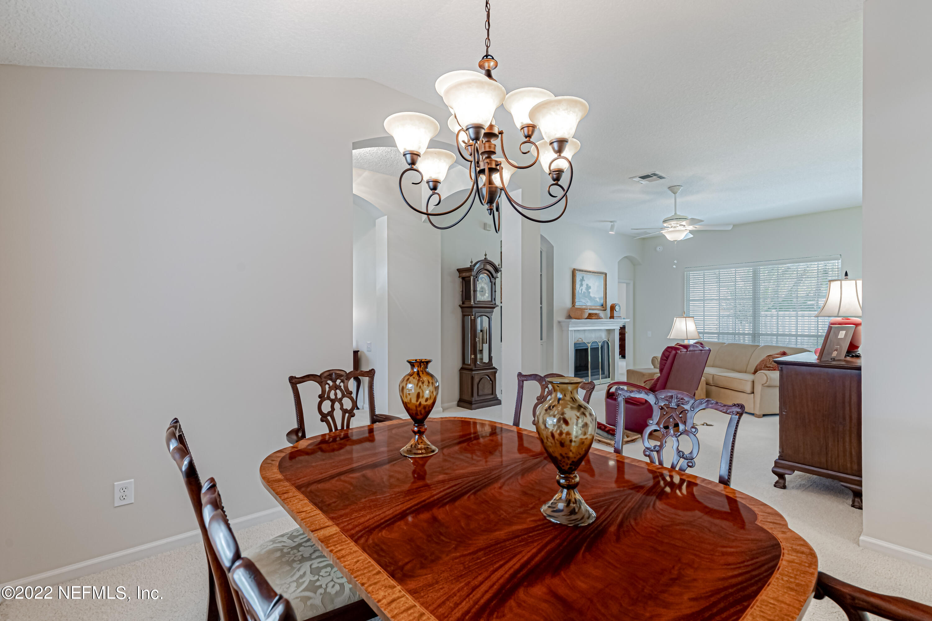 124 Dragonfly Drive Jacksonville, FL 32259 - Photo 10 of 40 a living room with dining table and chairs
