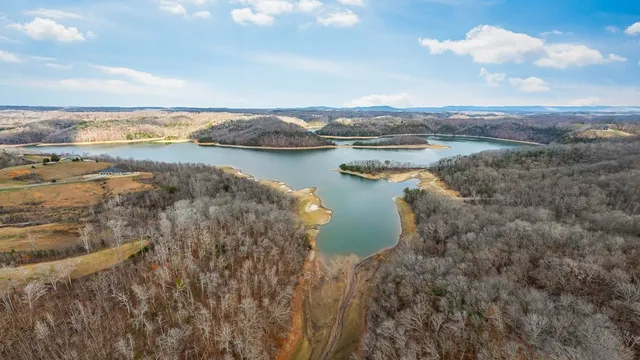 a view of a lake with houses in the back