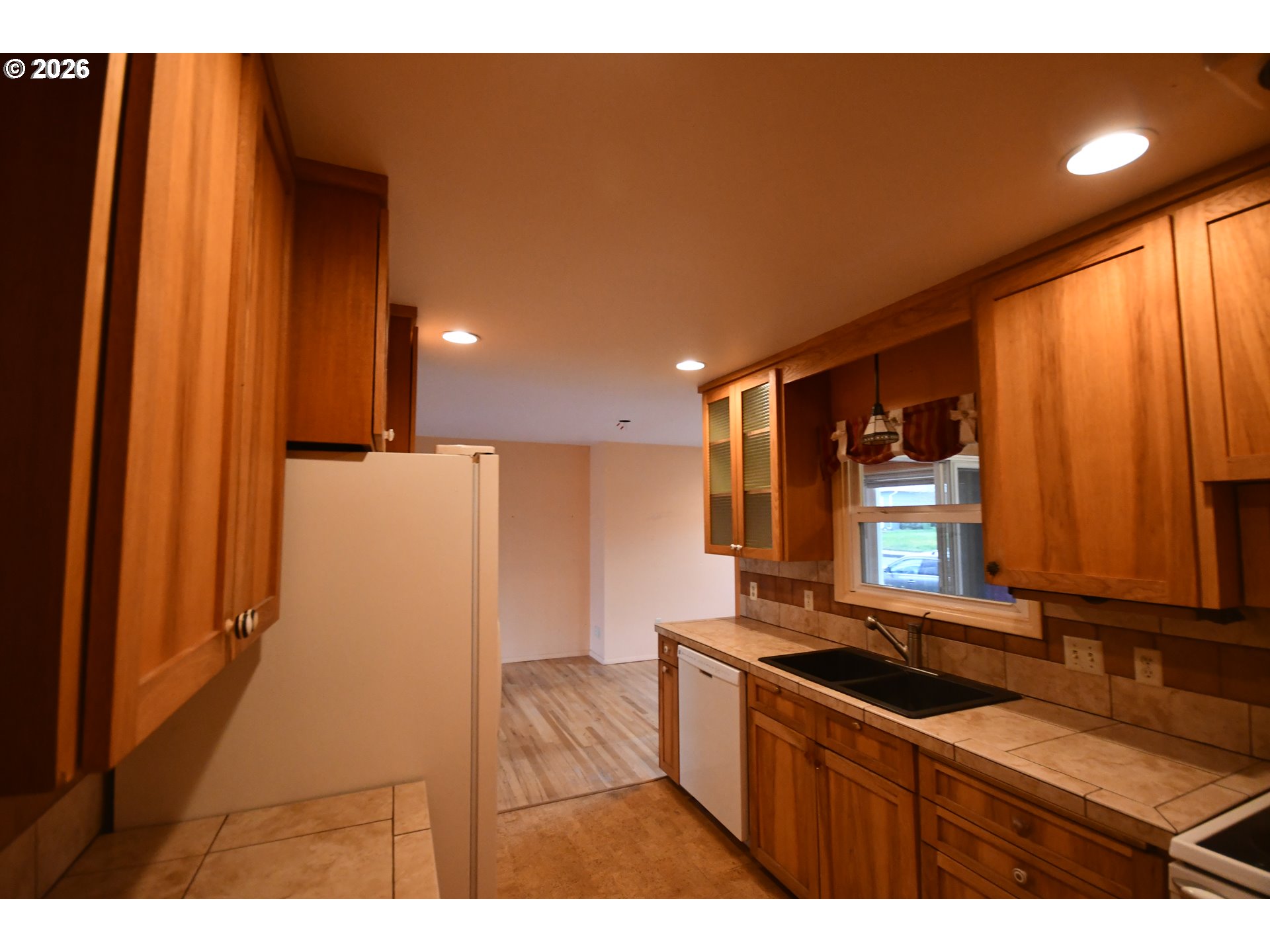 731 East 19th Street The Dalles, OR 97058 - Photo 18 of 42 a kitchen with stainless steel appliances a sink stove and cabinets