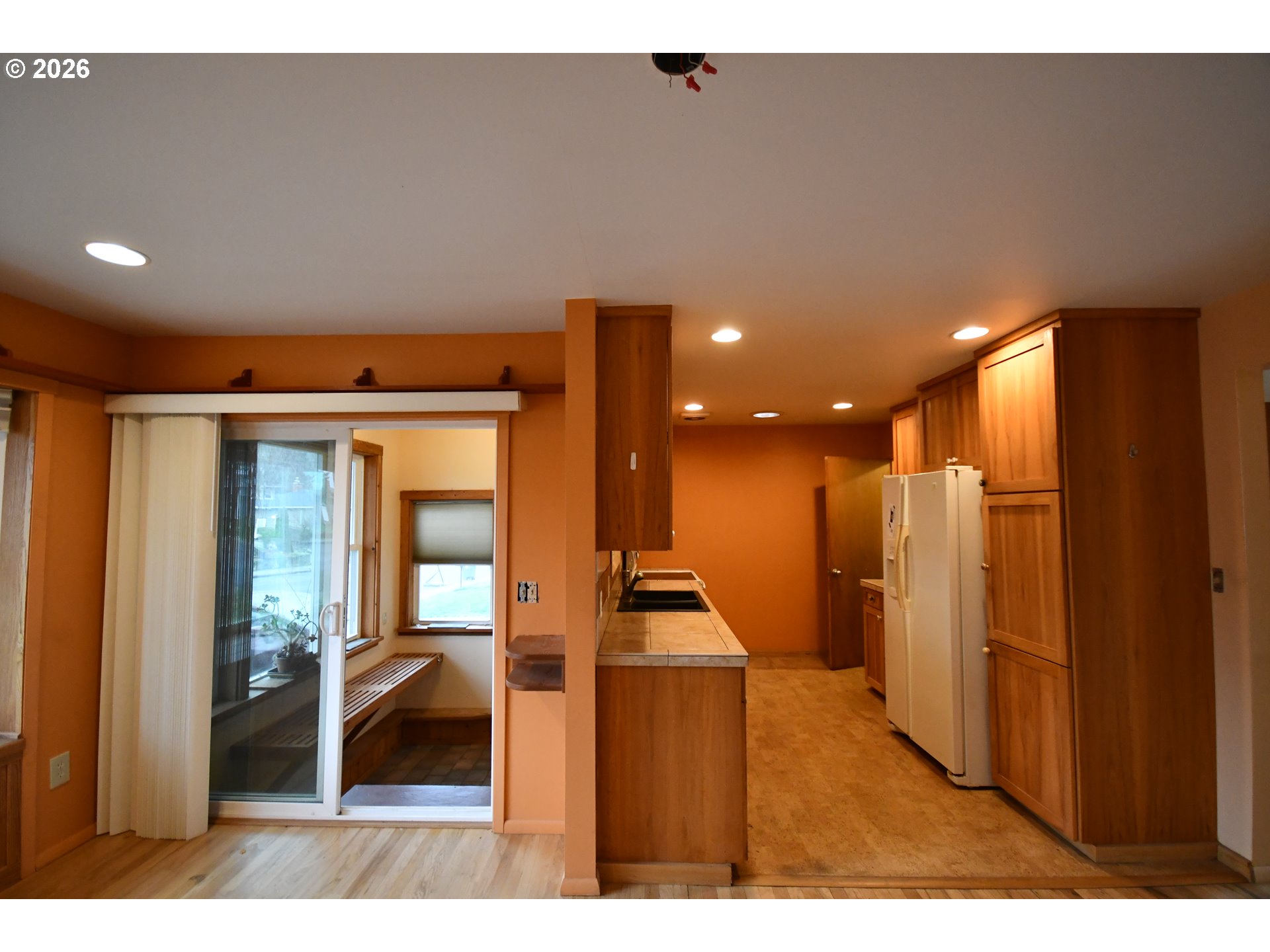 731 East 19th Street The Dalles, OR 97058 - Photo 22 of 42 a view of a hallway with wooden floor and furniture