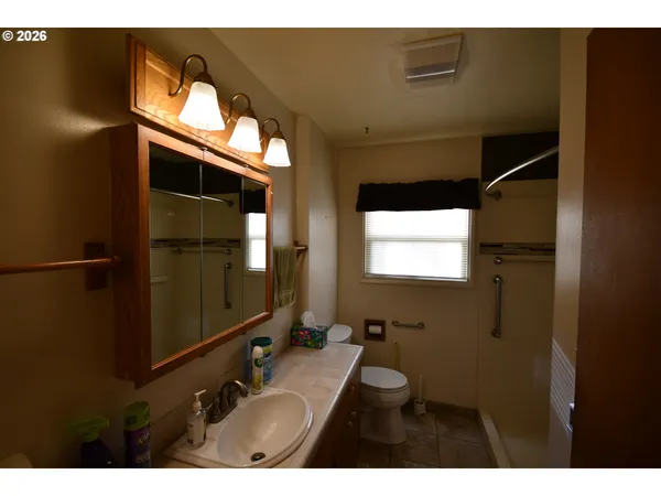 a bathroom with a sink and mirror