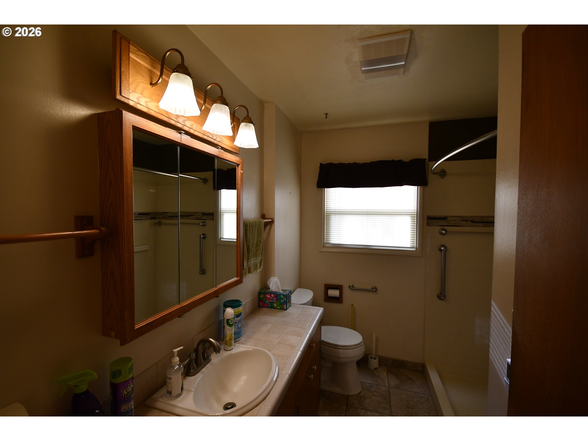 731 East 19th Street The Dalles, OR 97058 - Photo 23 of 42 a bathroom with a sink and mirror