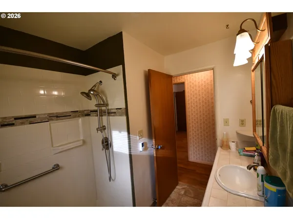 a bathroom with a sink and mirror