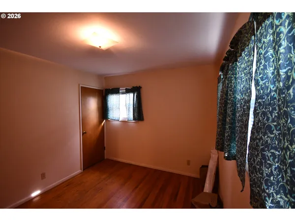 a view of an empty room and window