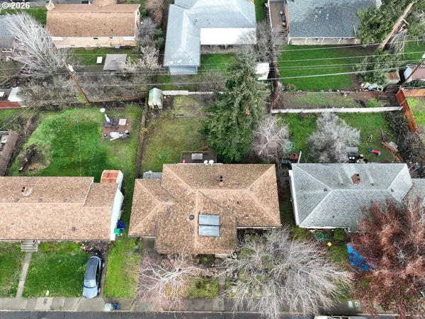 an aerial view of a house with outdoor space