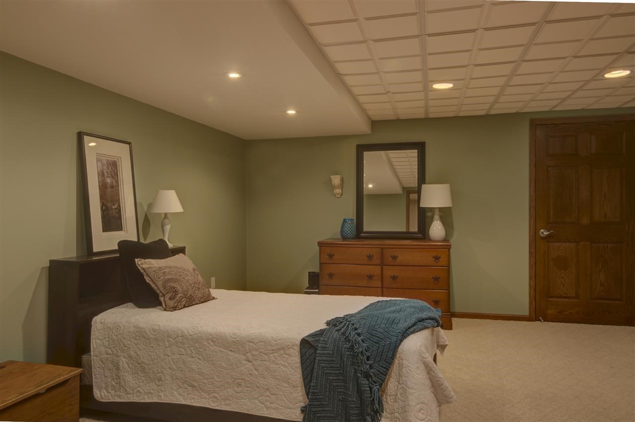 12210 Bellingham Road Caledonia, IL 61011 - Photo 18 of 24 a bedroom with a bed and a dresser