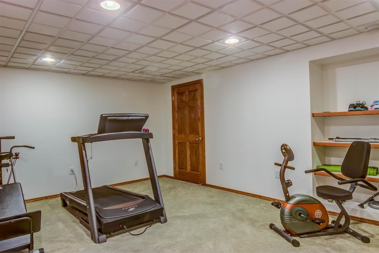 12210 Bellingham Road Caledonia, IL 61011 - Photo 21 of 24 a room with gym equipment
