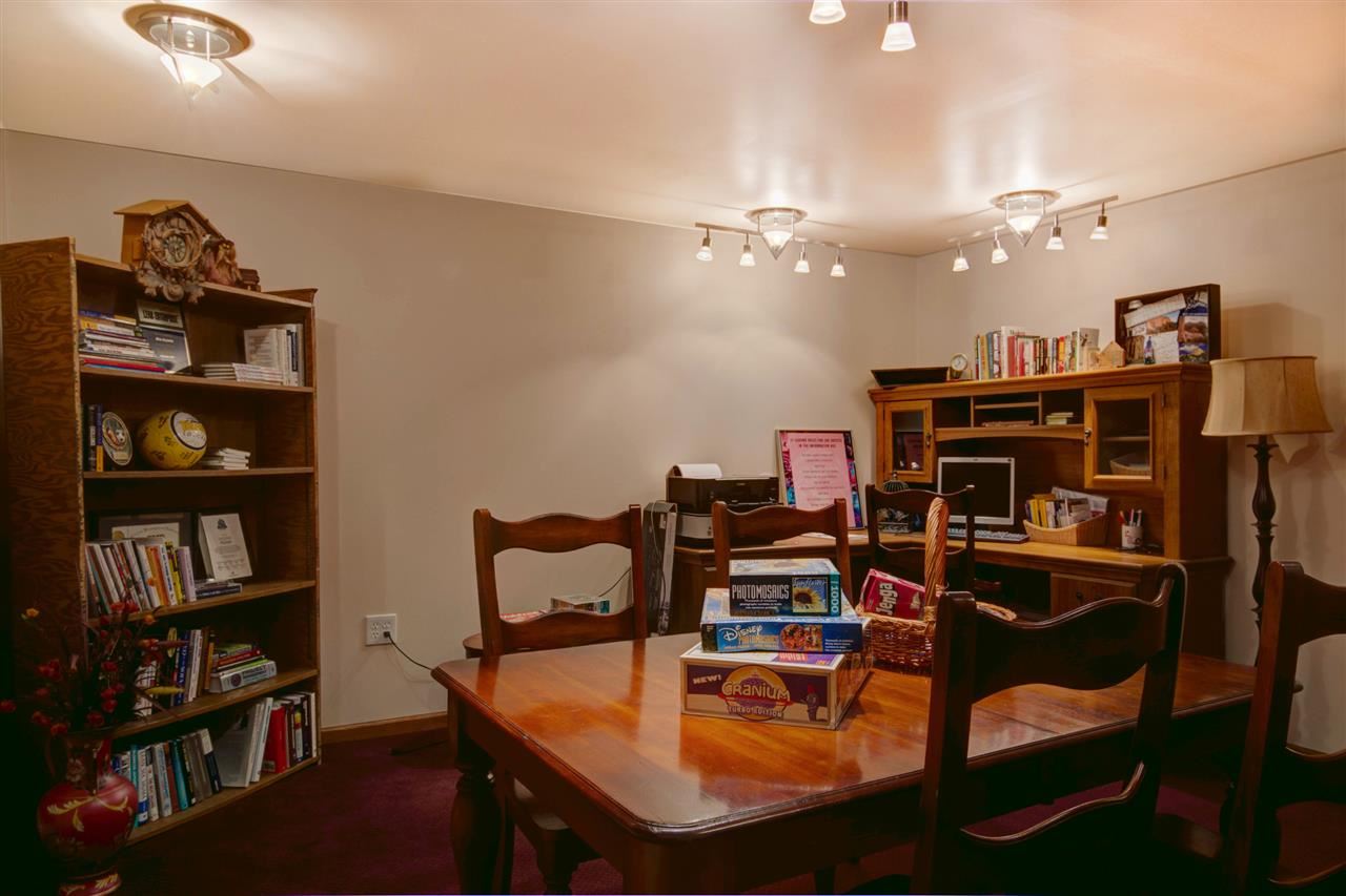 12210 Bellingham Road Caledonia, IL 61011 - Photo 22 of 24 a room with furniture and a book shelf