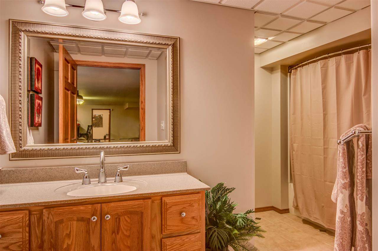 12210 Bellingham Road Caledonia, IL 61011 - Photo 23 of 24 a bathroom with a sink and a mirror