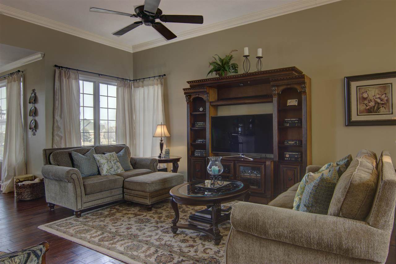 12210 Bellingham Road Caledonia, IL 61011 - Photo 3 of 24 a living room with furniture and a fireplace