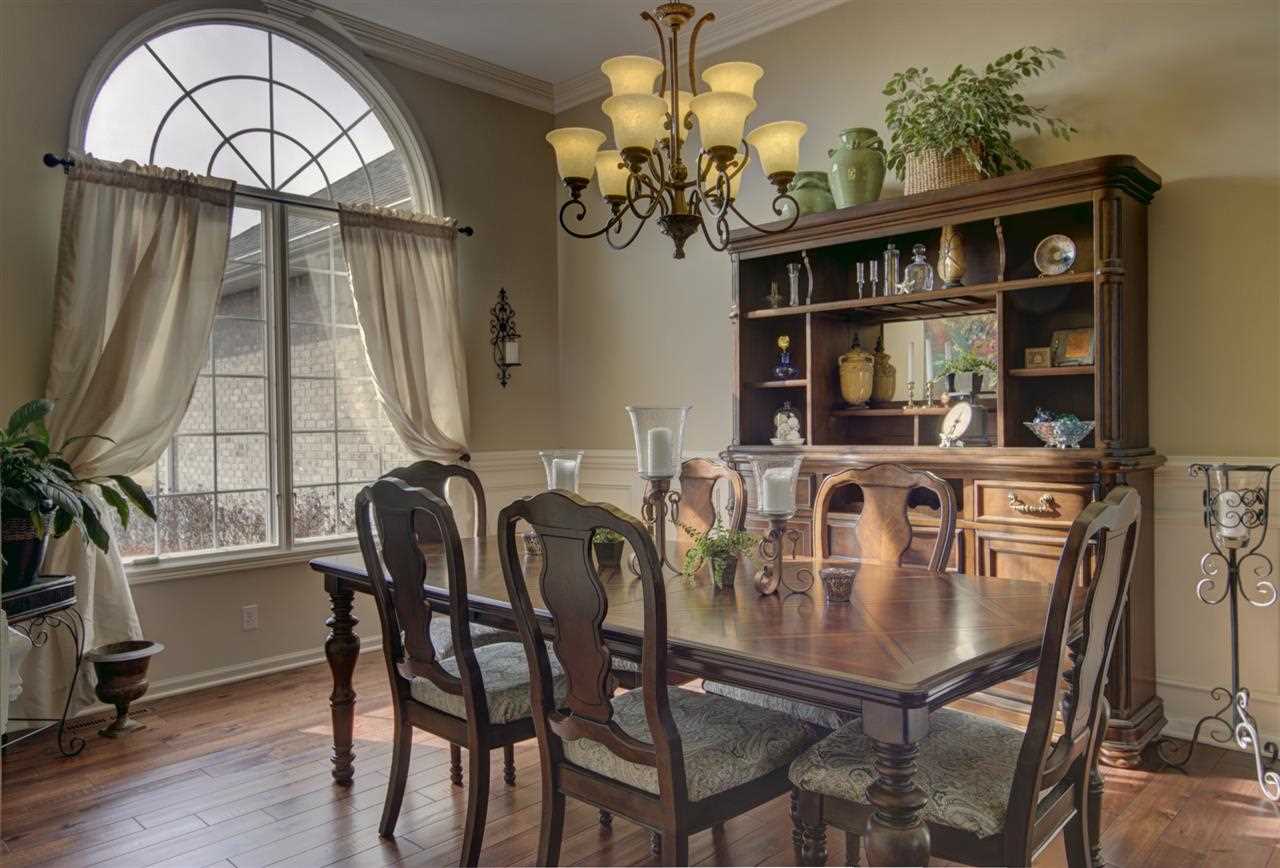 12210 Bellingham Road Caledonia, IL 61011 - Photo 8 of 24 a view of a dining room with furniture and a chandelier
