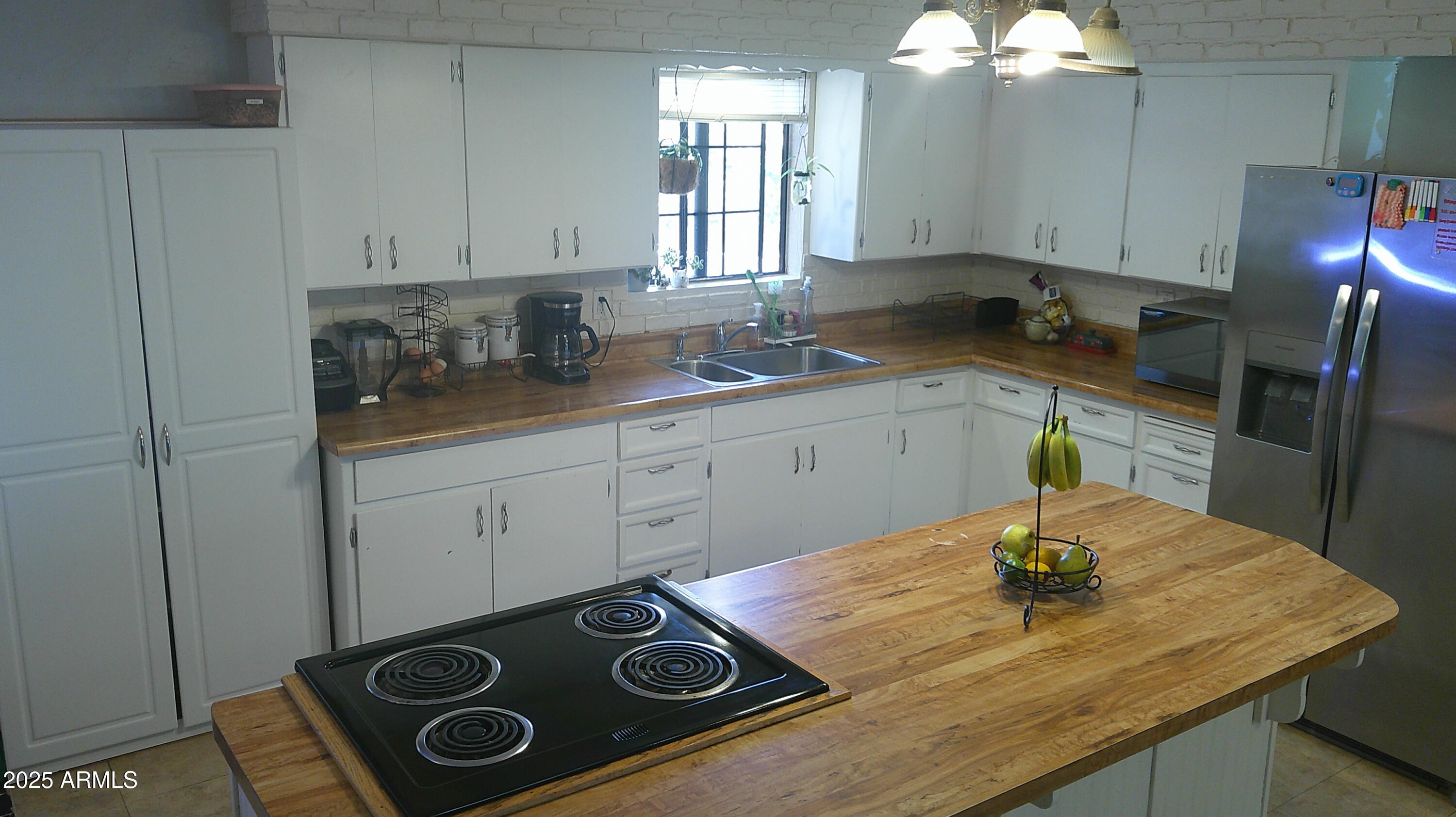 44 South 3rd Street West Snowflake, AZ 85937 - Photo 11 of 70 a kitchen with a stove a sink and cabinets