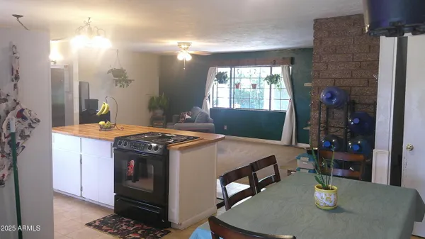 a living room filled with furniture and a window