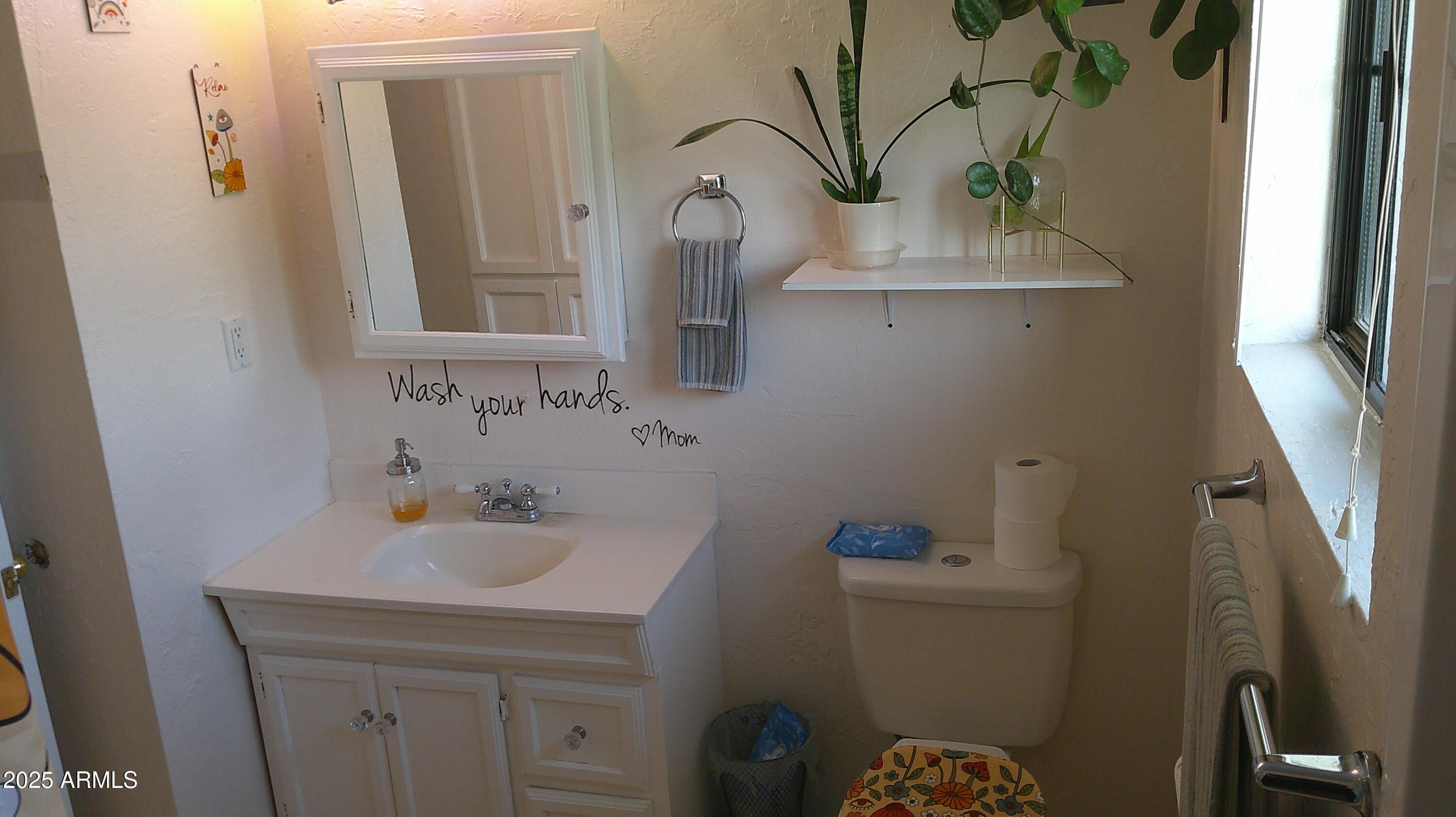 44 South 3rd Street West Snowflake, AZ 85937 - Photo 28 of 70 a bathroom with a sink a toilet and mirror