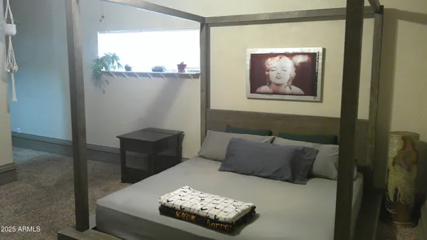 a view of a workspace with furniture and a fireplace