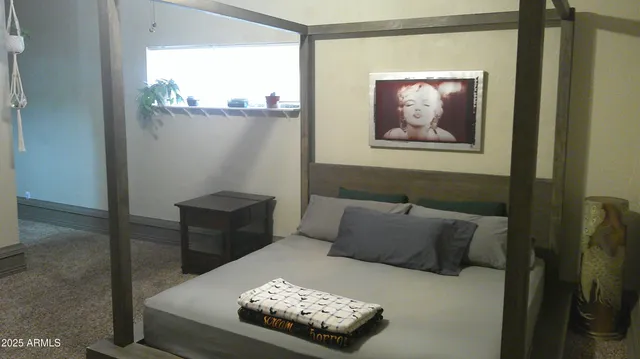 a view of a workspace with furniture and a fireplace