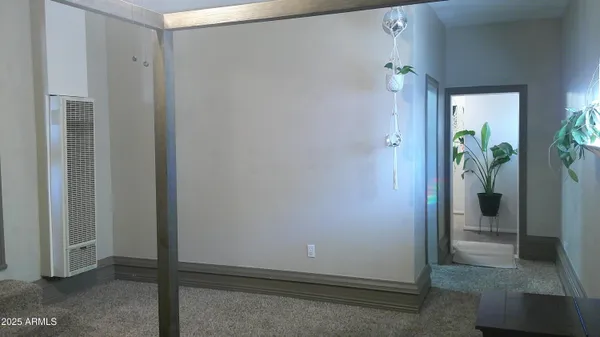a kitchen with cabinets and wooden floor