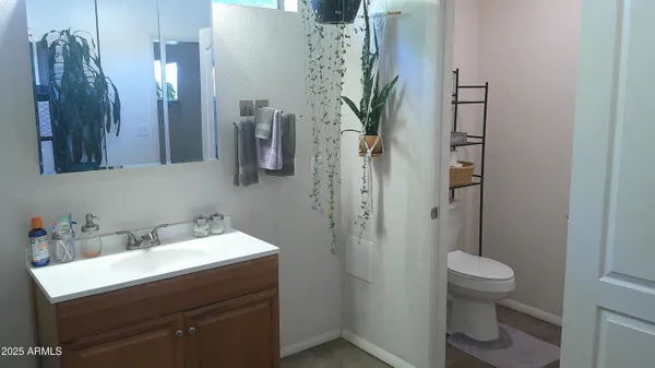 a view of room with furniture and wooden floor
